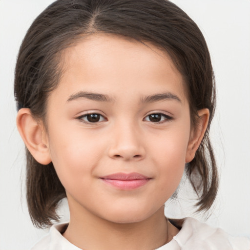 Joyful white child female with medium  brown hair and brown eyes