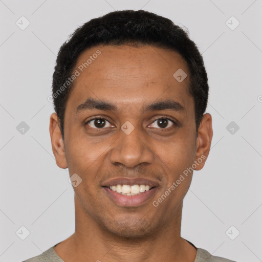 Joyful black young-adult male with short  black hair and brown eyes