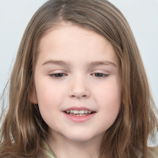 Joyful white child female with long  brown hair and brown eyes