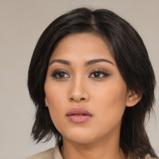 Neutral asian young-adult female with medium  black hair and brown eyes