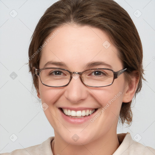 Joyful white adult female with medium  brown hair and blue eyes