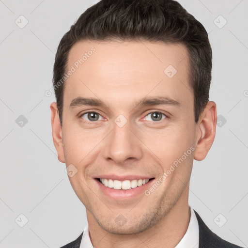 Joyful white young-adult male with short  brown hair and brown eyes