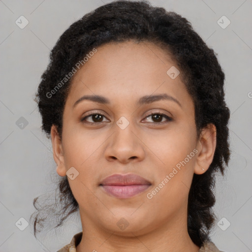 Joyful black adult female with medium  brown hair and brown eyes