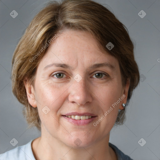 Joyful white adult female with medium  brown hair and grey eyes