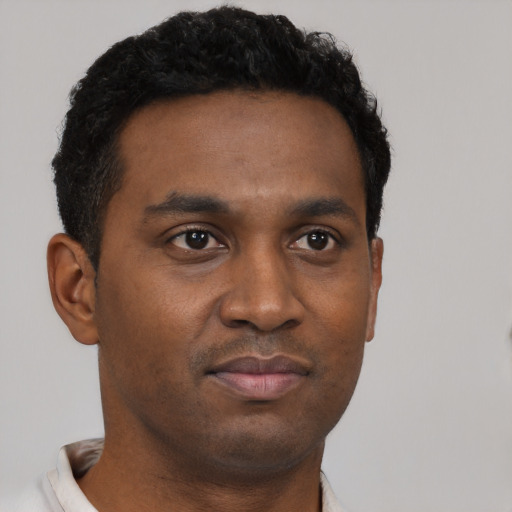 Neutral black young-adult male with short  brown hair and brown eyes