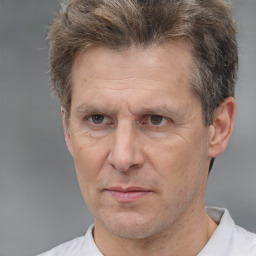 Neutral white middle-aged male with short  brown hair and brown eyes