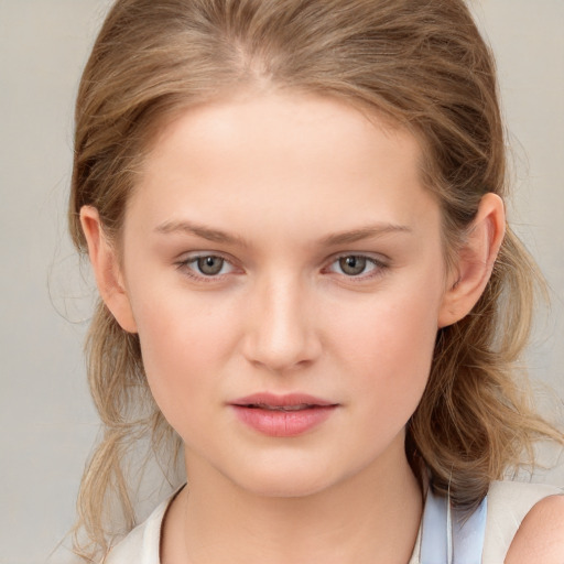 Joyful white child female with medium  brown hair and brown eyes