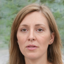 Joyful white adult female with medium  brown hair and green eyes