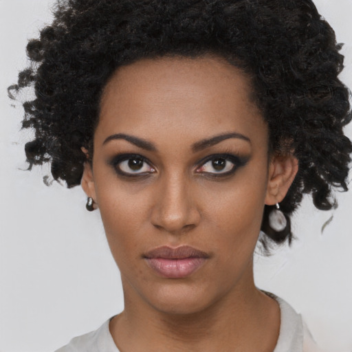 Neutral black young-adult female with short  brown hair and brown eyes