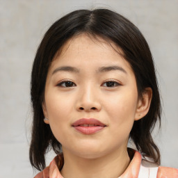 Joyful asian child female with medium  brown hair and brown eyes