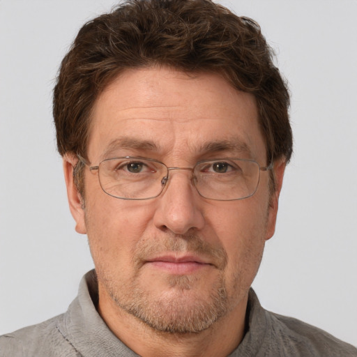 Joyful white adult male with short  brown hair and grey eyes