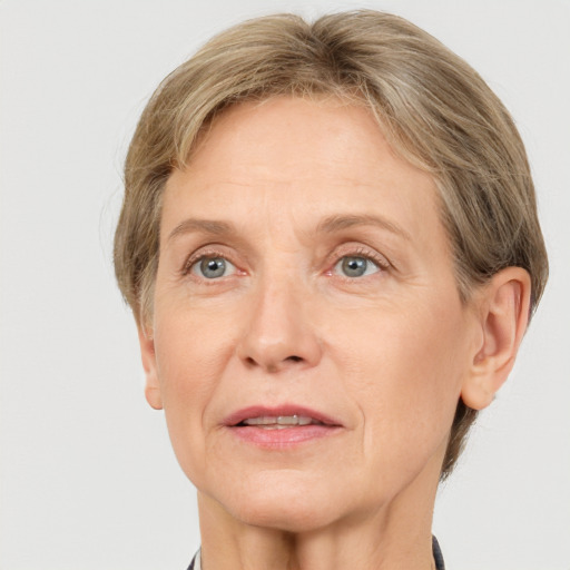 Joyful white adult female with short  brown hair and grey eyes