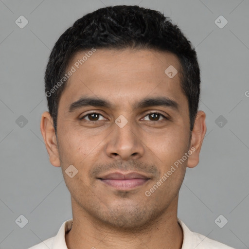 Joyful latino young-adult male with short  brown hair and brown eyes