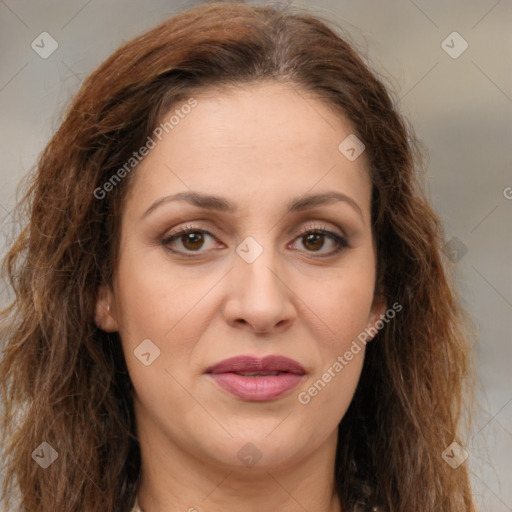 Joyful white adult female with long  brown hair and brown eyes