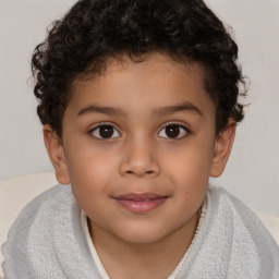 Joyful white child male with short  brown hair and brown eyes