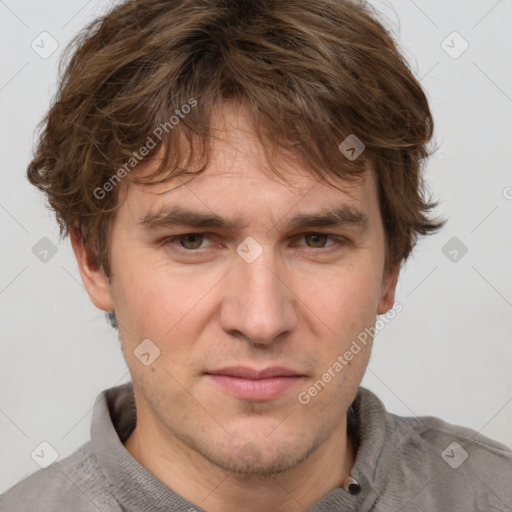 Joyful white adult male with short  brown hair and grey eyes