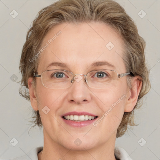 Joyful white adult female with medium  brown hair and blue eyes