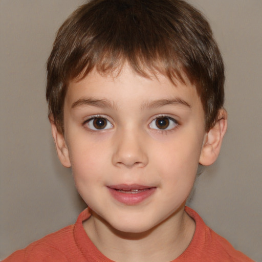 Joyful white child male with short  brown hair and brown eyes