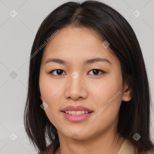 Joyful asian young-adult female with long  brown hair and brown eyes