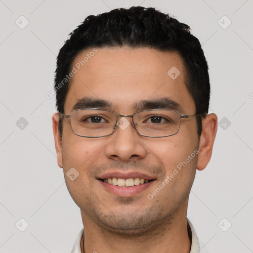 Joyful white young-adult male with short  black hair and brown eyes