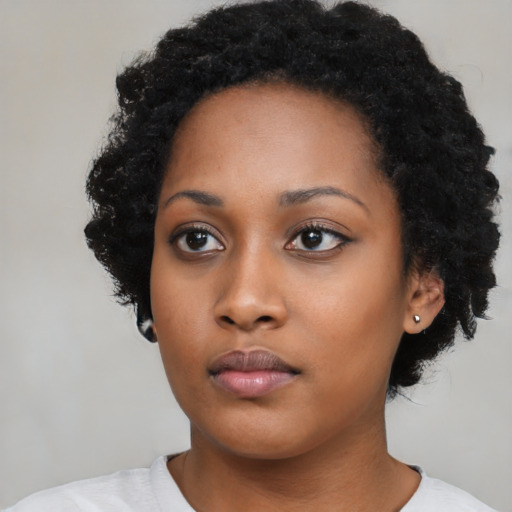 Neutral black young-adult female with short  black hair and brown eyes