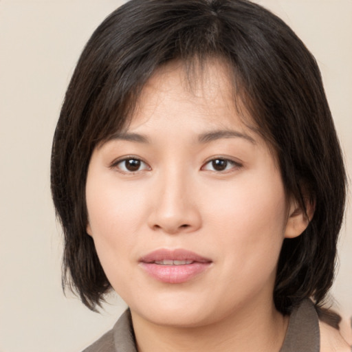 Neutral asian young-adult female with medium  brown hair and brown eyes