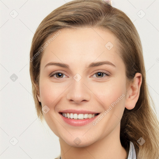 Joyful white young-adult female with long  brown hair and grey eyes