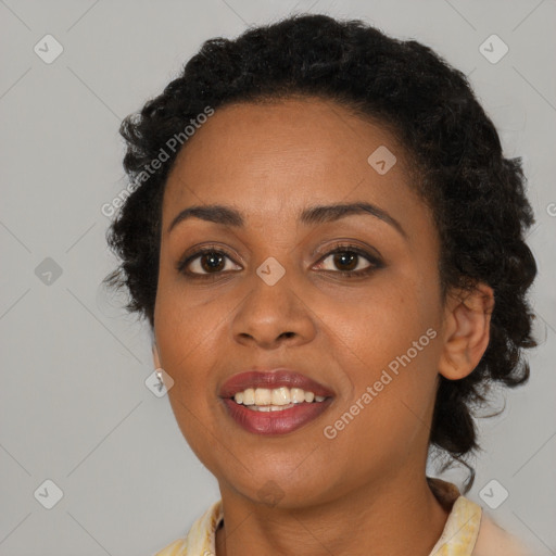 Joyful black young-adult female with medium  brown hair and brown eyes