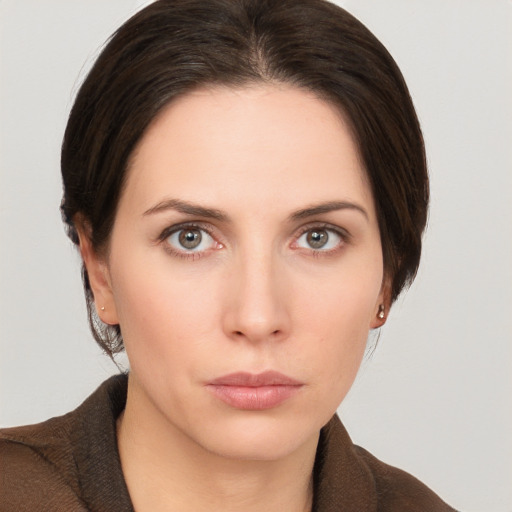 Neutral white young-adult female with short  brown hair and brown eyes