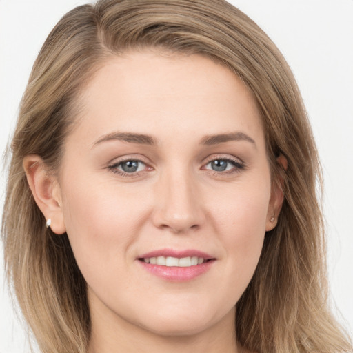 Joyful white young-adult female with long  brown hair and grey eyes