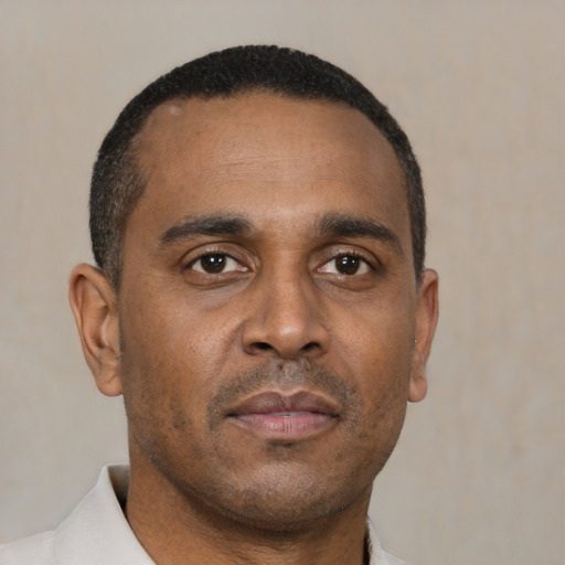 Neutral black adult male with short  brown hair and brown eyes