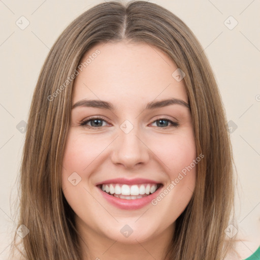 Joyful white young-adult female with long  brown hair and green eyes