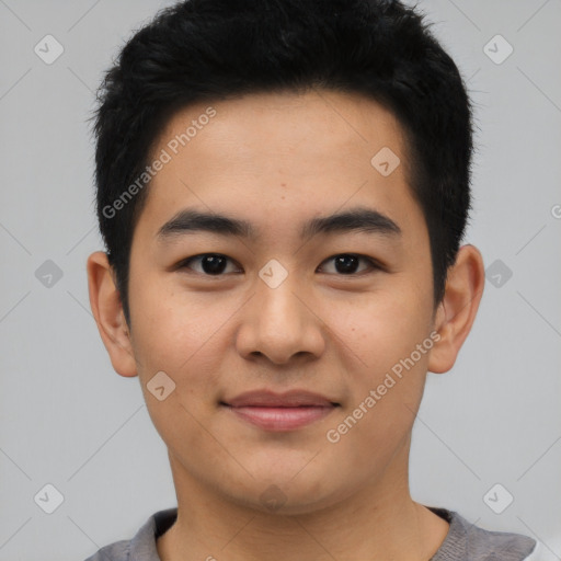 Joyful asian young-adult male with short  black hair and brown eyes