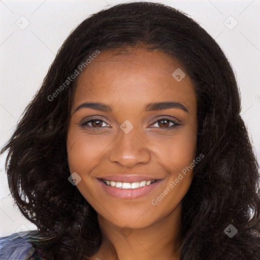 Joyful black young-adult female with long  black hair and brown eyes