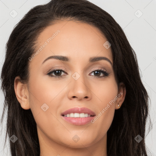 Joyful latino young-adult female with long  brown hair and brown eyes