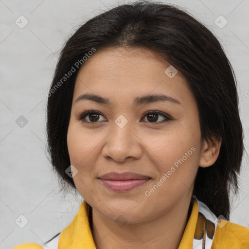 Joyful latino young-adult female with medium  brown hair and brown eyes