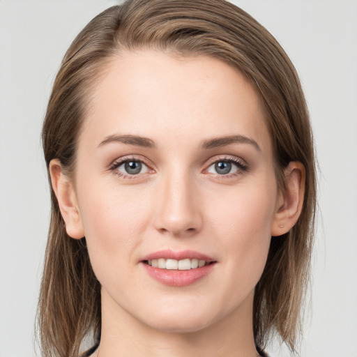 Joyful white young-adult female with long  brown hair and grey eyes