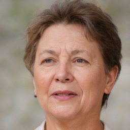 Joyful white middle-aged female with short  brown hair and brown eyes