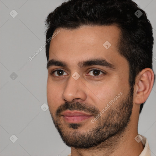 Joyful white young-adult male with short  black hair and brown eyes