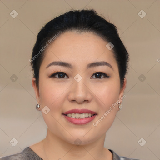 Joyful asian young-adult female with short  black hair and brown eyes