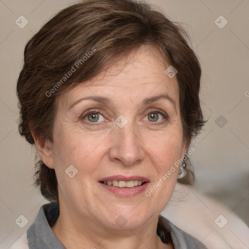 Joyful white adult female with medium  brown hair and blue eyes