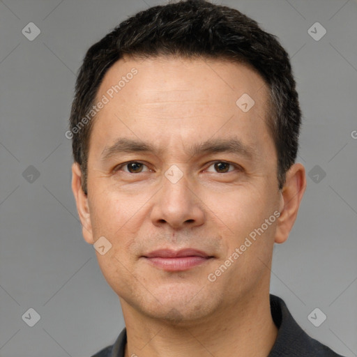 Joyful white adult male with short  brown hair and brown eyes