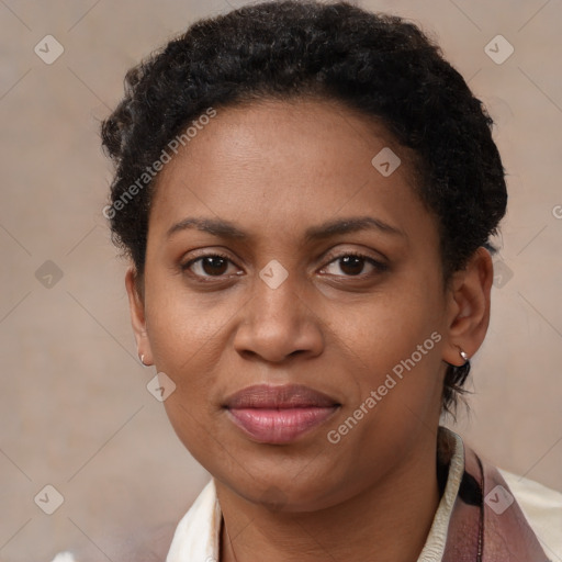 Joyful black adult female with short  brown hair and brown eyes