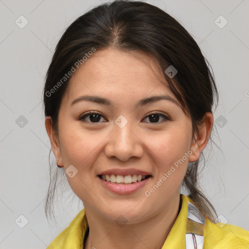 Joyful latino young-adult female with medium  brown hair and brown eyes