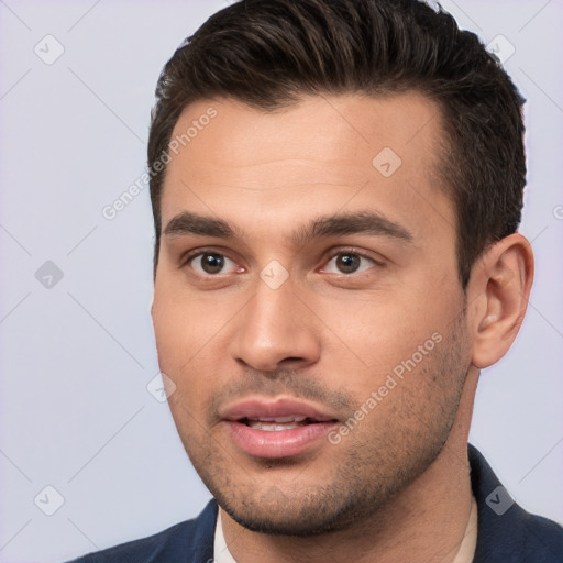 Joyful white young-adult male with short  brown hair and brown eyes