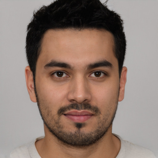 Neutral latino young-adult male with short  black hair and brown eyes