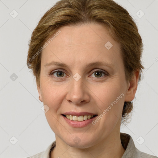 Joyful white adult female with medium  brown hair and grey eyes