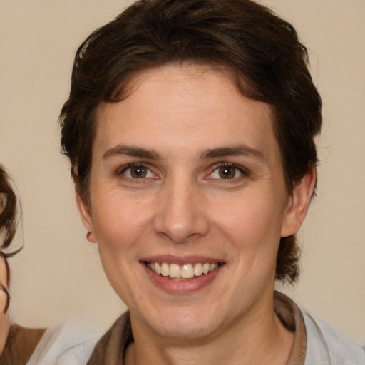 Joyful white young-adult female with medium  brown hair and brown eyes