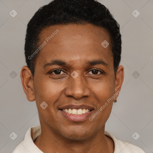 Joyful latino young-adult male with short  brown hair and brown eyes