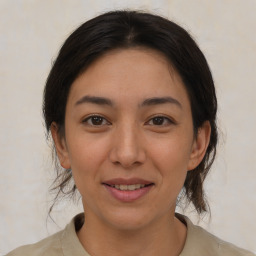 Joyful asian young-adult female with medium  brown hair and brown eyes